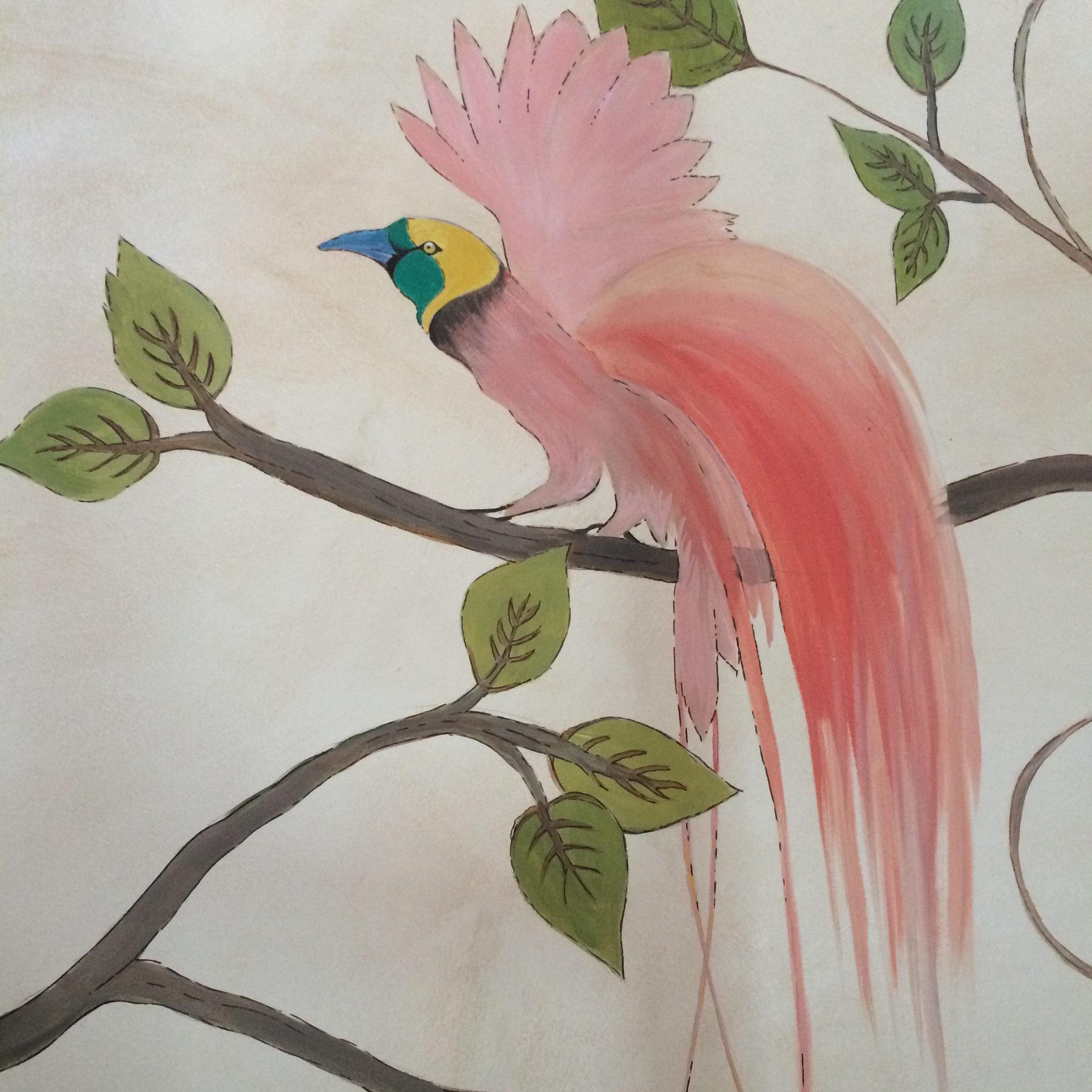 Detail of a bird of paradise painted on a branch, with pink plumage