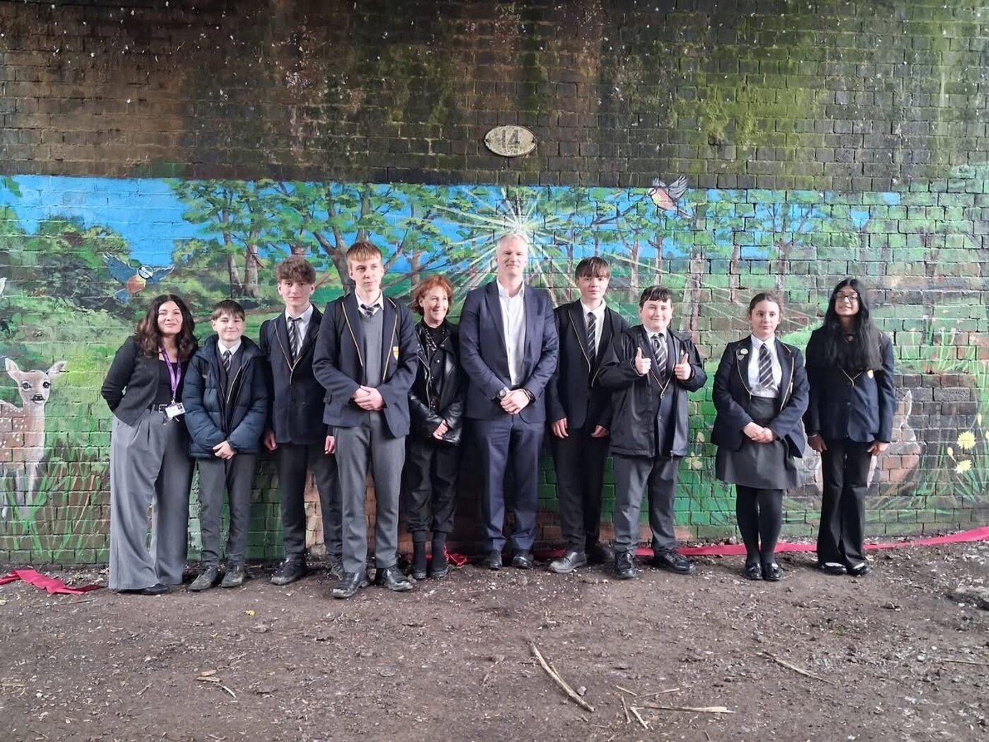 Pupils and staff at the mural opening